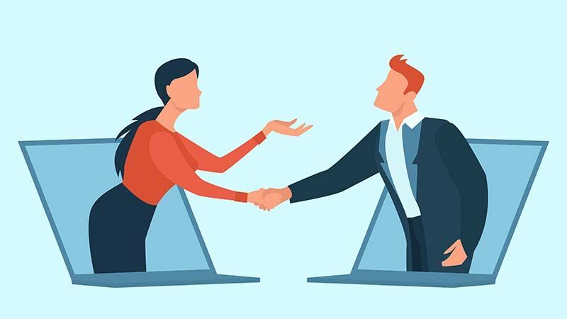 zwei Leute schütteln die Hände in einem Geschäftstreffen